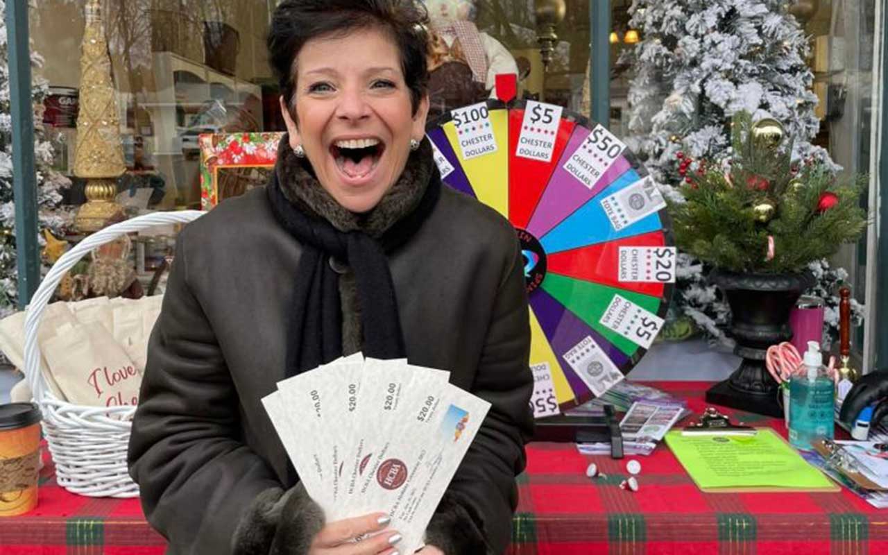 Spin to Win on Main Street in Chester photo, happy winner of Chester Dollars