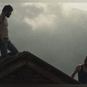 Film: The Eight Mountains graphic with two men on a mountaintop